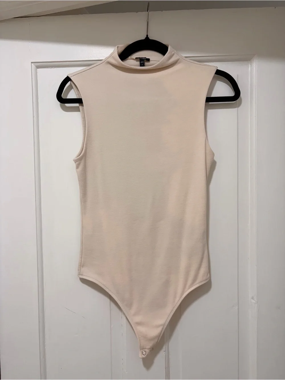 Sleeveless Mock Neck One-Piece Bodysuit in Cream
